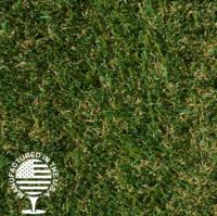 A close up image of artificial grass with green and brown
