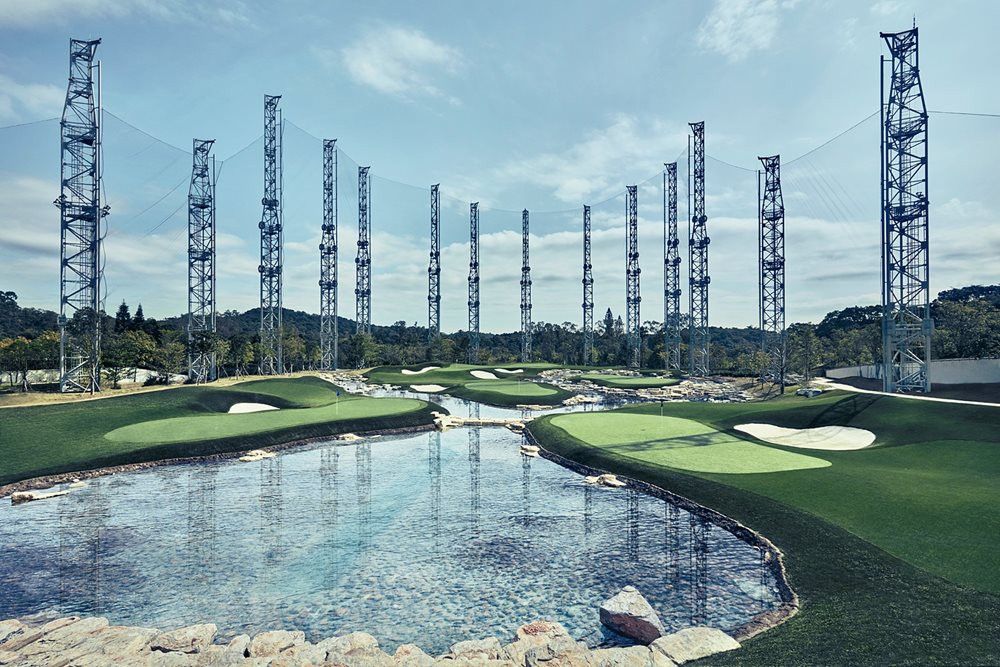 Jacksonville Synthetic grass golf course with water and tall metal towers