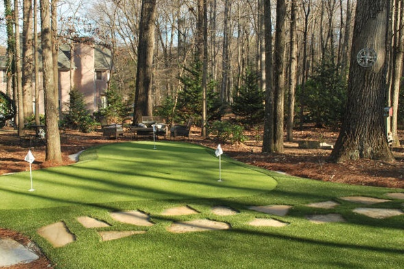Jacksonville backyard putting green with flags and trees