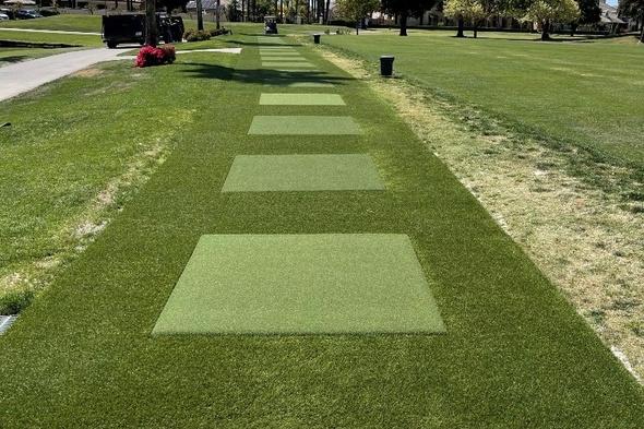 Jacksonville Outdoor tee line with light green synthetic grass boxes inside a dark green synthetic grass strip